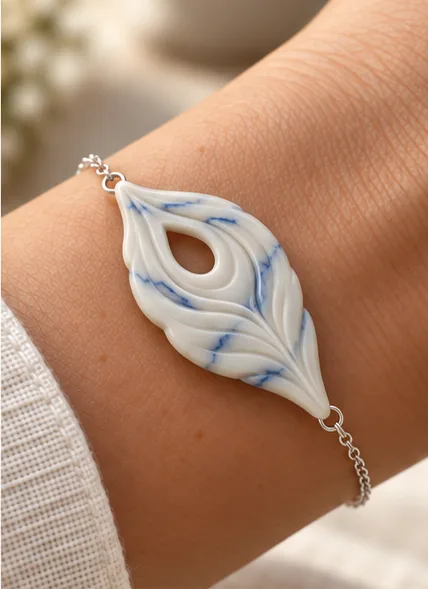 Blue-veined ivory bracelet on a wrist